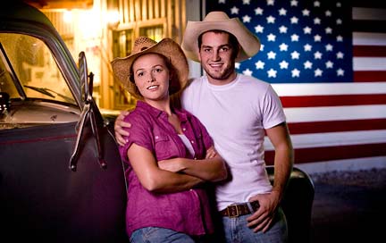 Young couple in front of country store.